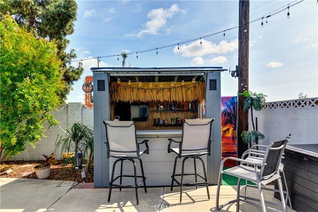 view of patio featuring fence private yard and outdoor dry bar
