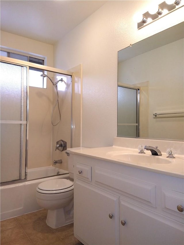 660 S Glassell St Unit 54, Orange, CA 92866 - full bath featuring vanity, toilet, tile patterned flooring, and combined bath / shower with glass door