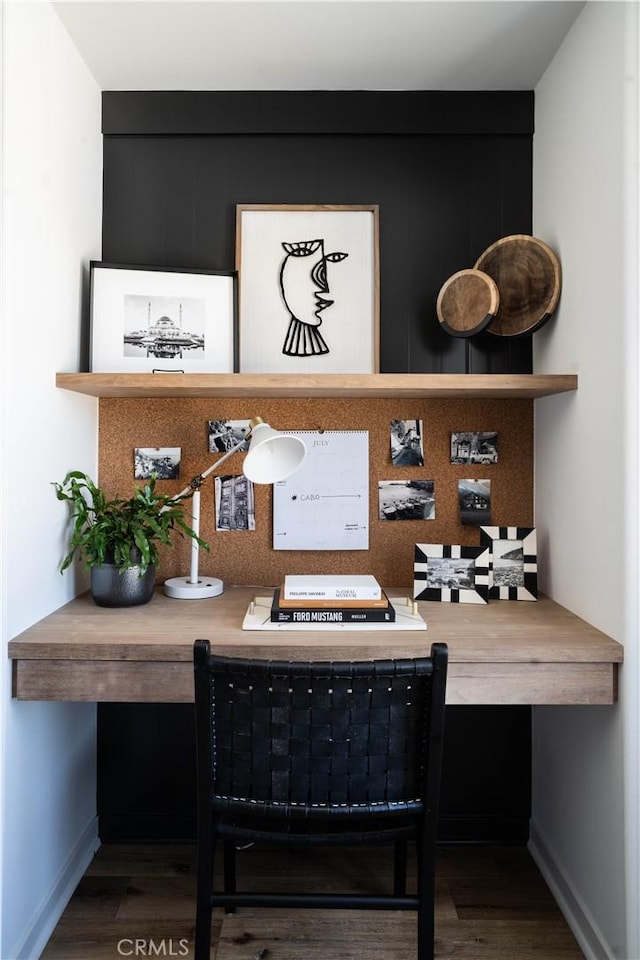 home office with baseboards and wood finished floors