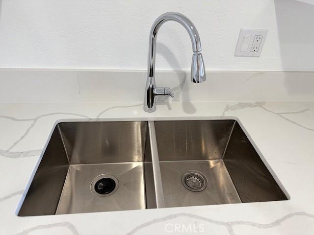 321 S San Vicente Blvd S Unit 402, Los Angeles, CA 90048 - room details with light stone countertops and a sink