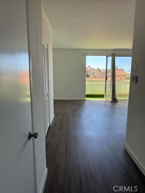 321 S San Vicente Blvd S Unit 402, Los Angeles, CA 90048 - unfurnished room featuring baseboards and dark wood-type flooring