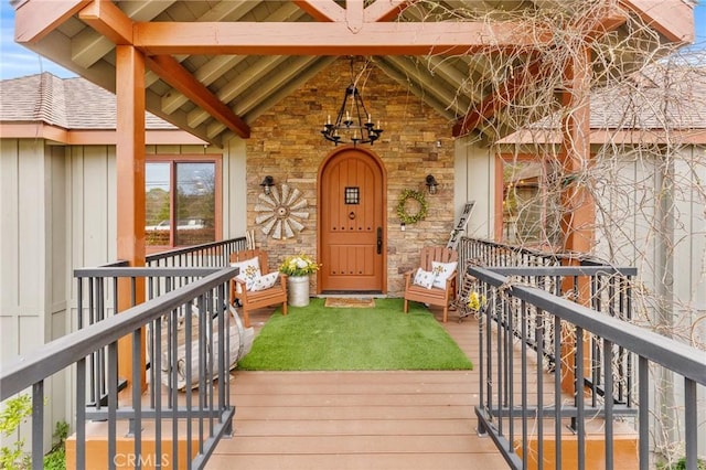 1405 Rock Ridge Dr, Lake Arrowhead, CA 92352 - doorway to property featuring board and batten siding, a porch, a shingled roof, and stone siding