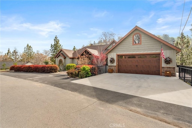 1405 Rock Ridge Dr, Lake Arrowhead, CA 92352 - ranch-style house with an attached garage, stone siding, driveway, a chimney, and board and batten siding