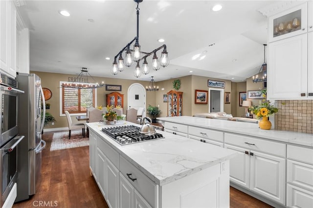 1405 Rock Ridge Dr, Lake Arrowhead, CA 92352 - kitchen featuring recessed lighting, white cabinetry, a kitchen island, and appliances with stainless steel finishes