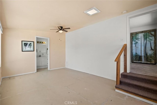 568 4th St, Willows, CA 95988 - unfurnished room featuring concrete floors, ceiling fan, stairs, and a smoke detector