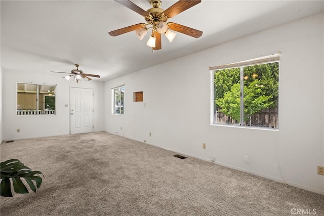 568 4th St, Willows, CA 95988 - empty room featuring plenty of natural light, carpet, and ceiling fan