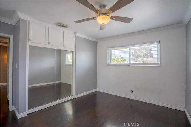 14967 Dunton Dr, Whittier, CA 90604 - unfurnished bedroom with dark wood-type flooring, crown molding, baseboards, and a closet