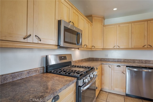 14967 Dunton Dr, Whittier, CA 90604 - kitchen featuring stainless steel appliances, light brown cabinets, recessed lighting, and dark countertops