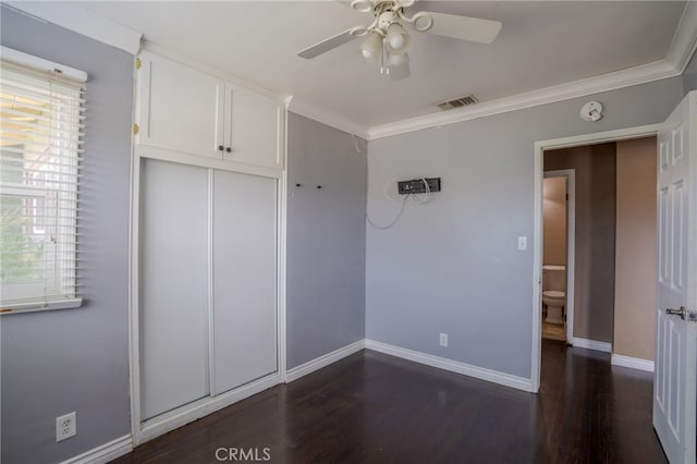 14967 Dunton Dr, Whittier, CA 90604 - unfurnished bedroom with multiple windows, dark wood-style flooring, baseboards, and crown molding