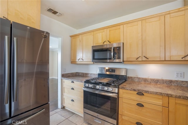14967 Dunton Dr, Whittier, CA 90604 - kitchen with stainless steel appliances and light brown cabinetry