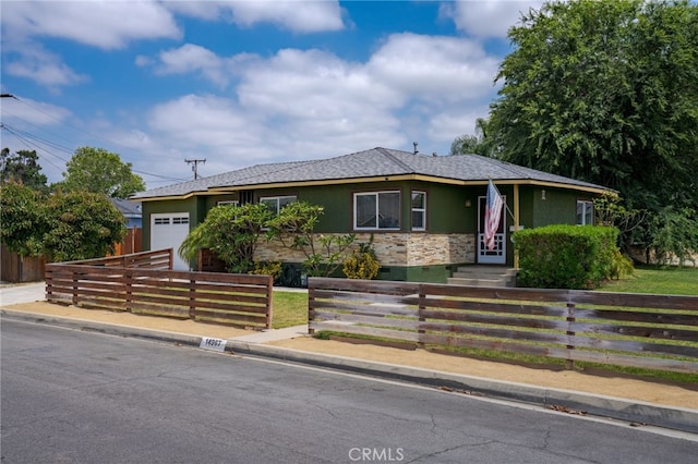 14967 Dunton Dr, Whittier, CA 90604 - ranch-style house with an attached garage, a fenced front yard, stucco siding, and stone siding