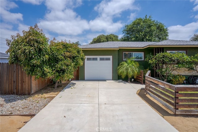 14967 Dunton Dr, Whittier, CA 90604 - view of front of property featuring driveway, a garage, stucco siding, and a shingled roof