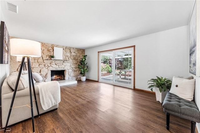 12172 Manley St, Garden Grove, CA 92845 - living area with wood finished floors, baseboards, and a fireplace