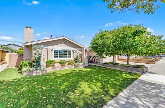12172 Manley St, Garden Grove, CA 92845 - view of front of home with a front yard, a chimney, and stucco siding
