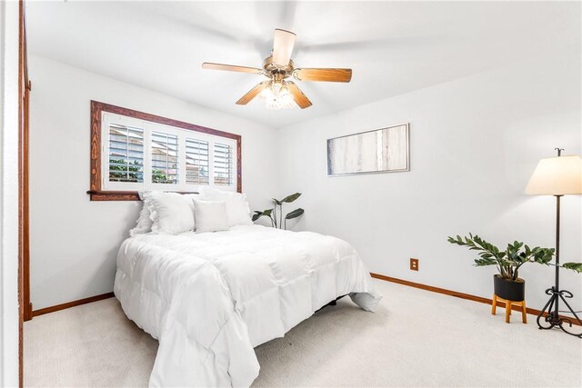 12172 Manley St, Garden Grove, CA 92845 - bedroom with light colored carpet, baseboards, and ceiling fan