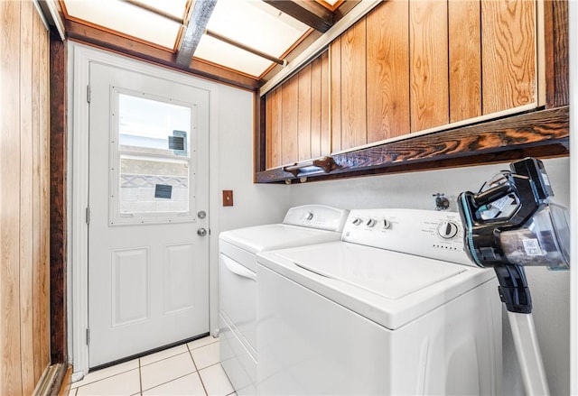 12172 Manley St, Garden Grove, CA 92845 - laundry room featuring cabinet space, washer and clothes dryer, and light tile patterned floors