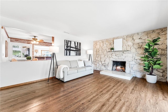 12172 Manley St, Garden Grove, CA 92845 - living area featuring wood finished floors, a fireplace, and ceiling fan