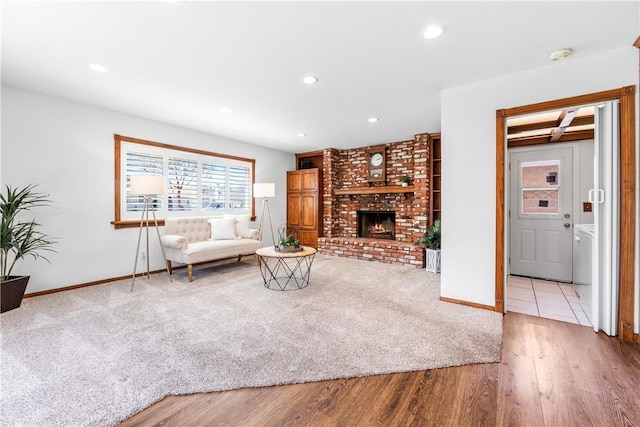 12172 Manley St, Garden Grove, CA 92845 - carpeted living area featuring baseboards, wood finished floors, recessed lighting, and a brick fireplace
