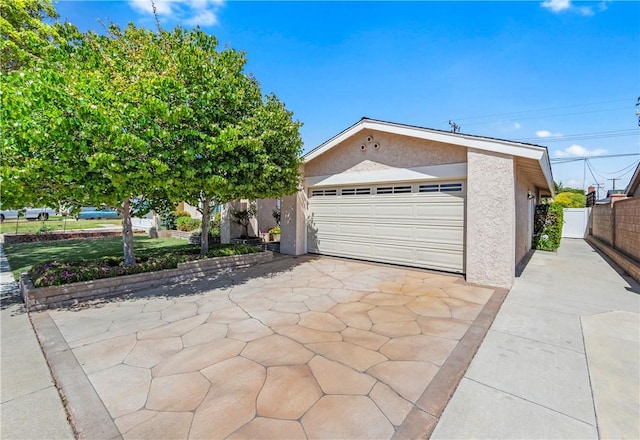 12172 Manley St, Garden Grove, CA 92845 - view of front of home with stucco siding and a detached garage