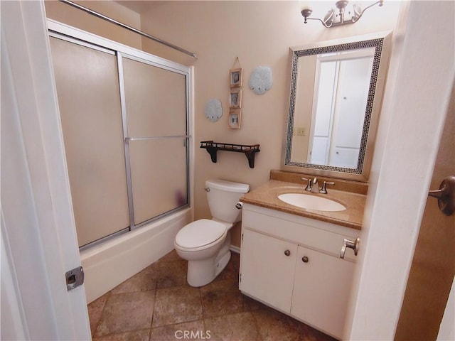 full bathroom with toilet, vanity, and shower / bath combination with glass door