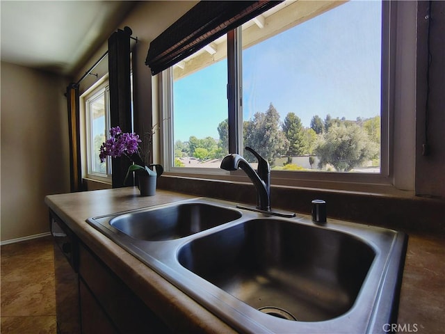kitchen view of a sink and baseboards