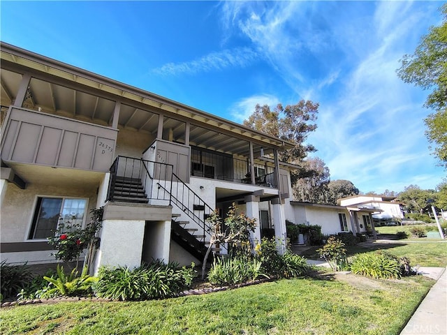 view of property featuring stairway