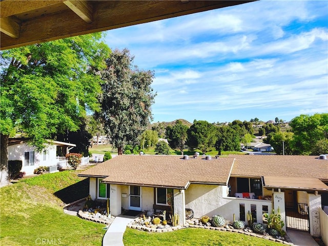 26373 Oak Highland Dr Unit E, Newhall, CA 91321 - view of front facade featuring stucco siding, a gate, and a shingled roof