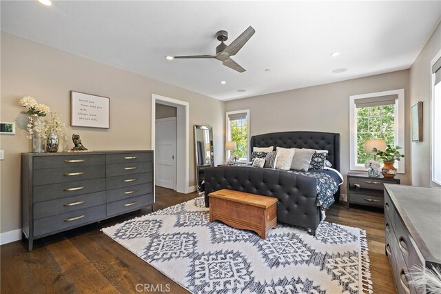 bedroom featuring dark wood-type flooring, recessed lighting, a ceiling fan, and baseboards