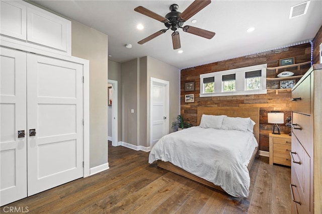 bedroom featuring wood finished floors, baseboards, recessed lighting, a closet, and a ceiling fan