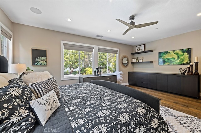 bedroom with wood finished floors, recessed lighting, and ceiling fan