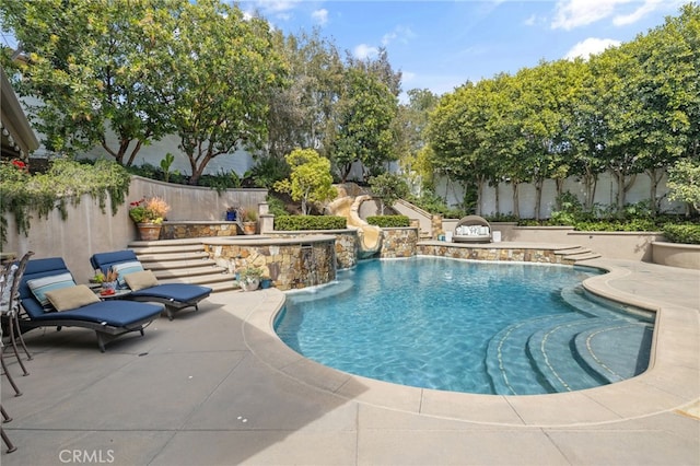 view of pool featuring a fenced backyard and a patio