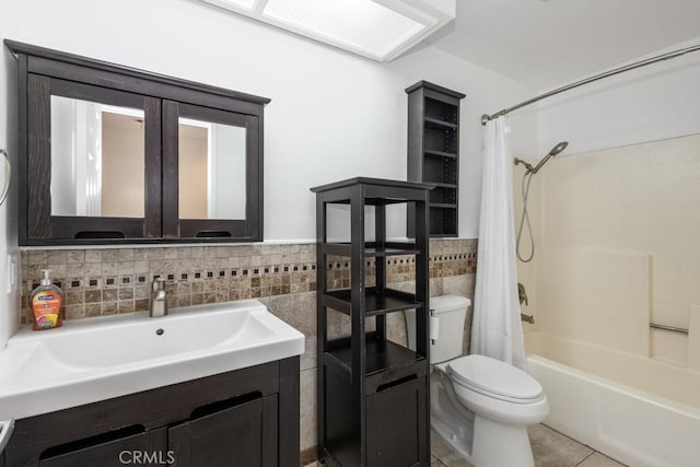 25283 Menominee Ct, Moreno Valley, CA 92553 - bathroom featuring tile walls, shower / tub combo, toilet, tile patterned floors, and vanity