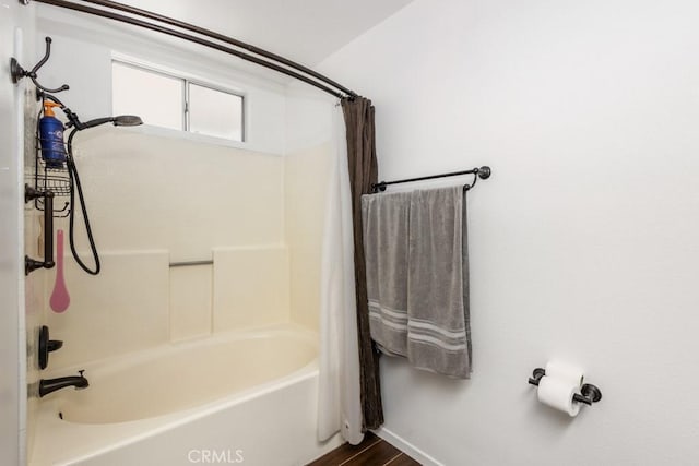 25283 Menominee Ct, Moreno Valley, CA 92553 - bathroom with shower / bathtub combination with curtain and wood finished floors