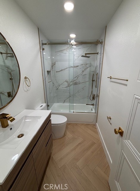 full bathroom with toilet, vanity, recessed lighting, combined bath / shower with glass door, and baseboards