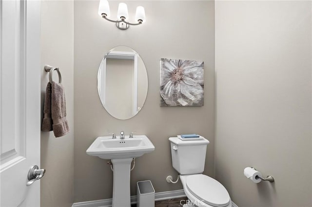 22811 Rolling Brook Ln, Wildomar, CA 92595 - half bath featuring toilet, baseboards, and a sink