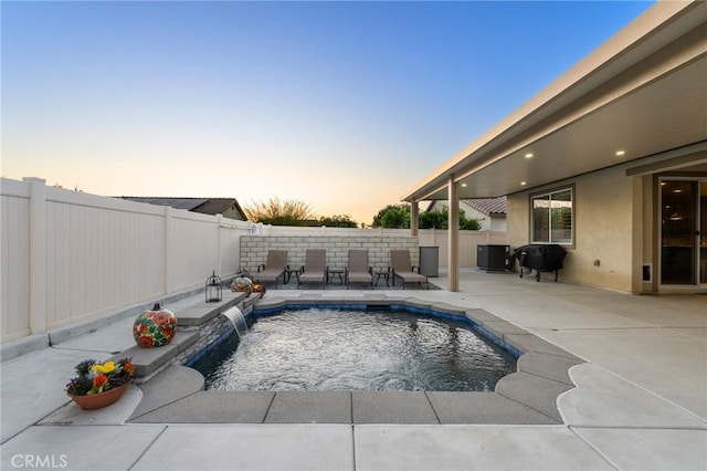 22811 Rolling Brook Ln, Wildomar, CA 92595 - pool at dusk with a patio area, central air condition unit, a fenced backyard, and area for grilling