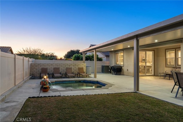 22811 Rolling Brook Ln, Wildomar, CA 92595 - pool at dusk with a fenced backyard, cooling unit, and a patio