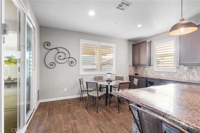 22811 Rolling Brook Ln, Wildomar, CA 92595 - kitchen featuring dark wood-style floors, tasteful backsplash, recessed lighting, hanging light fixtures, and baseboards