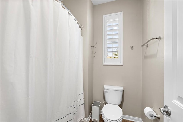 22811 Rolling Brook Ln, Wildomar, CA 92595 - bathroom featuring toilet, baseboards, and a shower with shower curtain