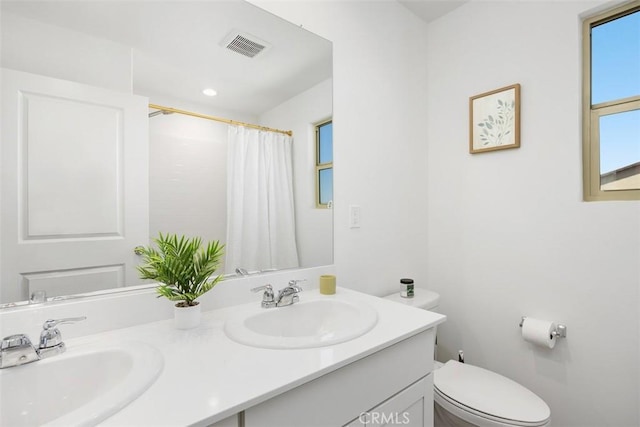 4872 Goldfinch St, Hemet, CA 92545 - full bathroom with double vanity, toilet, and curtained shower