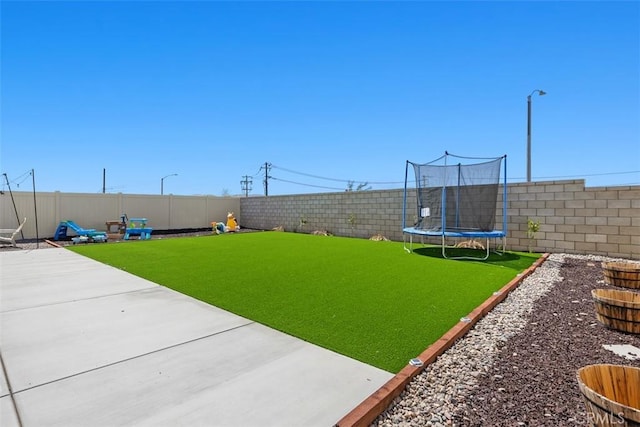 4872 Goldfinch St, Hemet, CA 92545 - view of yard featuring a trampoline and a patio area