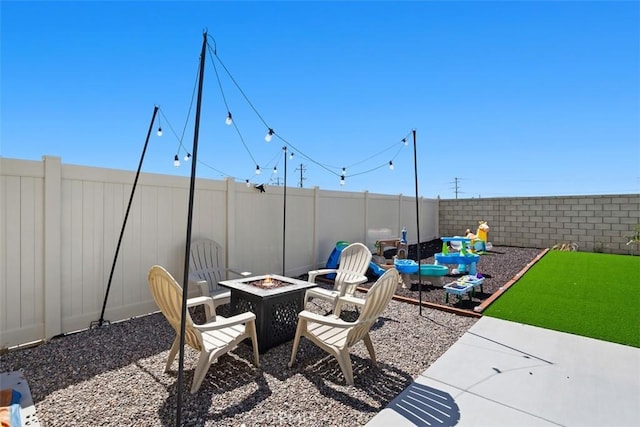 4872 Goldfinch St, Hemet, CA 92545 - fenced backyard with a fire pit and a patio area
