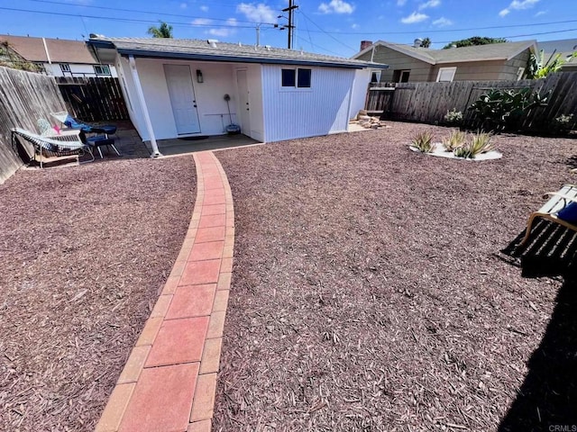 exterior space with a patio and a fenced backyard