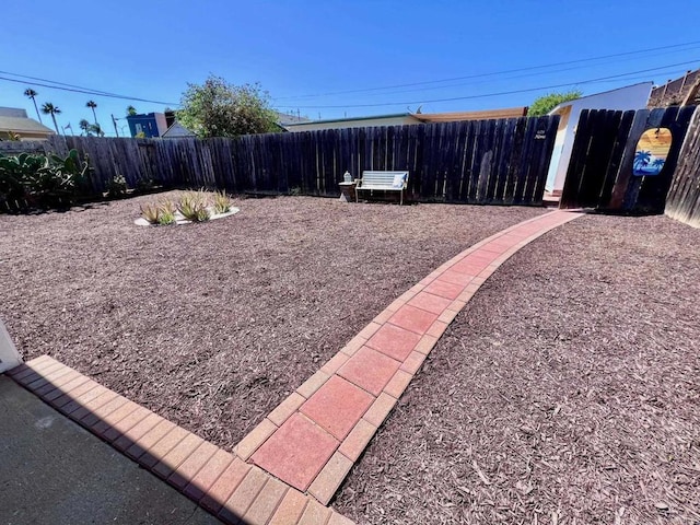 view of yard with a fenced backyard