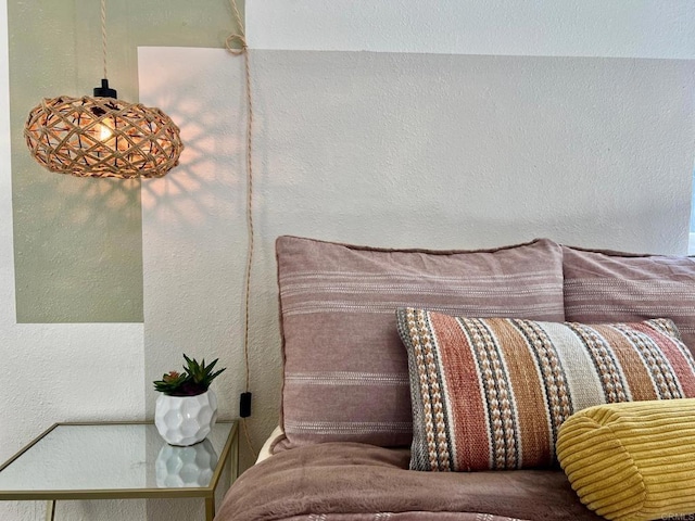 bedroom featuring a textured wall