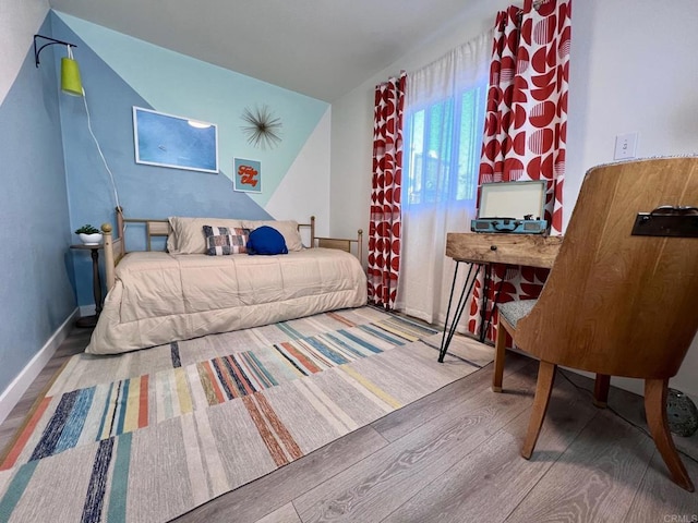 bedroom featuring wood finished floors