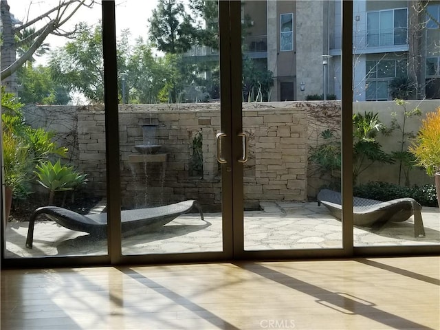 21 Gramercy Unit 115, Irvine, CA 92612 - doorway to outside featuring healthy amount of natural light