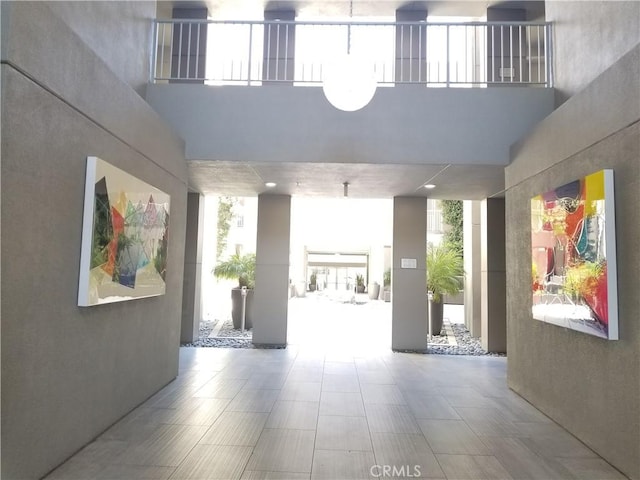 21 Gramercy Unit 115, Irvine, CA 92612 - common area with expansive windows and a high ceiling