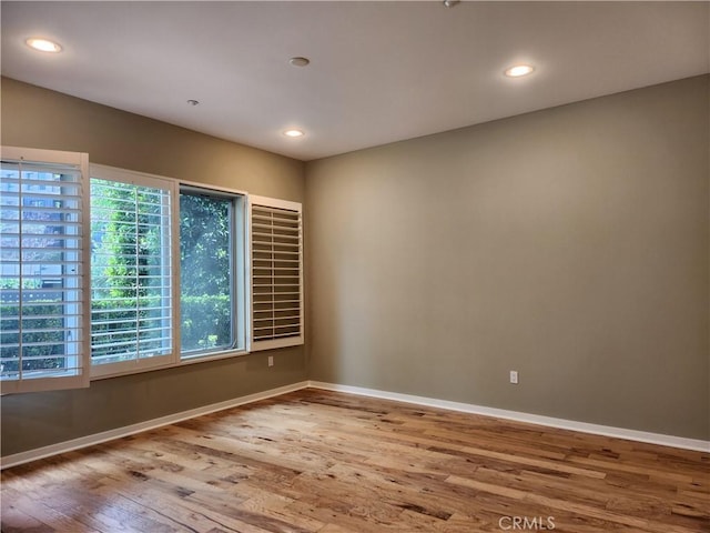 21 Gramercy Unit 115, Irvine, CA 92612 - empty room featuring wood finished floors and recessed lighting