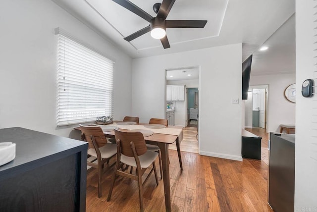 dining space with light wood-type flooring, baseboards, ceiling fan, and recessed lighting
